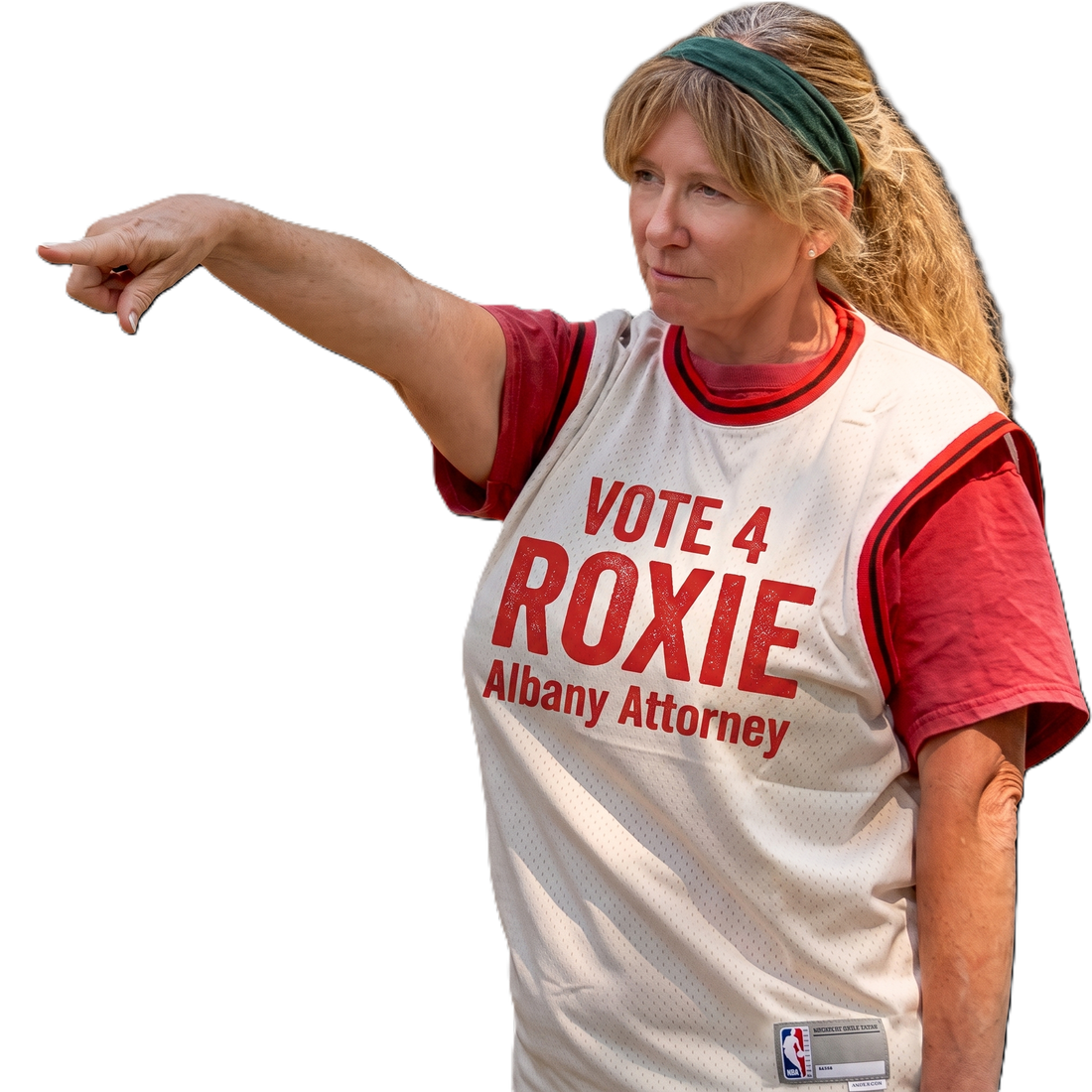 Roxie Hensley in a Vote 4 Roxie jersey pointing at her campaign sign